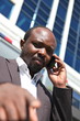 Young african businessman, talking mobile phone
