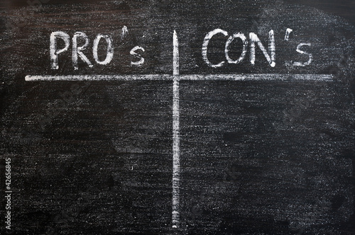 Photo: Pros and cons list drawn with chalk on a blackboard Pros and cons list drawn with chalk on a blackboard