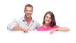Foto: Portrait of a happy couple holding a blank billboard Portrait of a happy couple holding a blank billboard