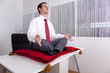 Photo: Businessman relaxing at the office Businessman relaxing at the office