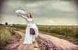The offended bride throwing out a wedding veil