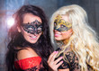 Photo: happy young girls under masks on the party happy young girls under masks on the party