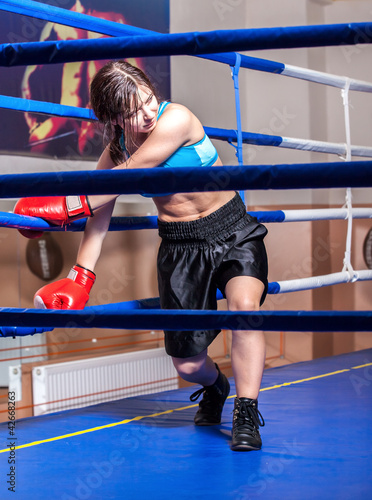 Photo: girl boxer in boxing ring girl boxer in boxing ring