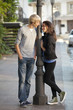 Foto: Young couple on the street of the city. Young couple on the street of the city.