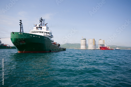 Photo: Ocean tugs towing base oil platform Ocean tugs towing base oil platform