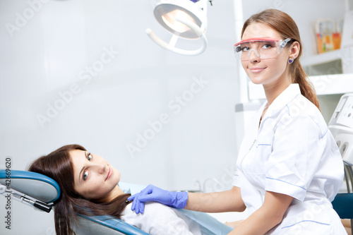 Photo: woman dentist working woman dentist working