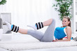 Girl exercising with ankle weights