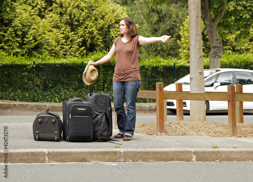Photo: auto-stoppeuse, départ en vacances auto-stoppeuse, départ en vacances