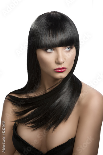 Photo: girl's portrait with long dark hair, she looks at left girl's portrait with long dark hair, she looks at left
