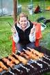 Photo: Woman with fork and knife in hands waiting for grill meat Woman with fork and knife in hands waiting for grill meat