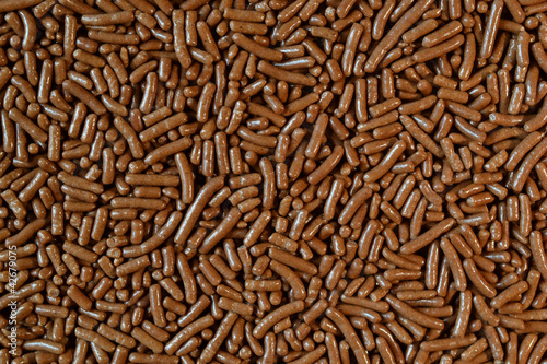 Photo: Micro photo of chocolate sprinkles. Micro photo of chocolate sprinkles.