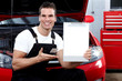 Auto mechanic with tablet.