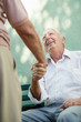 Group of happy elderly men laughing and talking