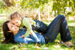 Woman with child having fun in autumn park