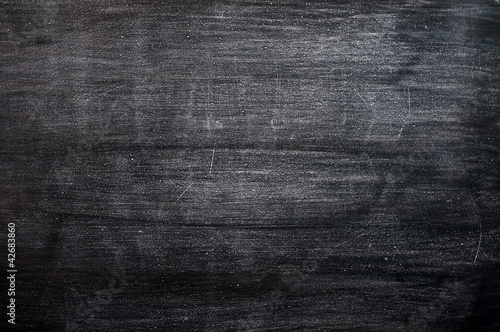Photo: Blank smudged blackboard background for text writing and design Blank smudged blackboard background for text writing and design