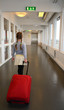 Young girl in departures corridor