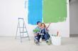 happy young cople relaxing after painting in new home