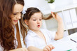 Foto: Mother and daughter studying Mother and daughter studying