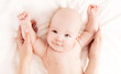 Mother massaging  baby