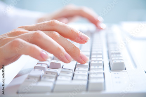 Photo: hands on computer keyboard hands on computer keyboard