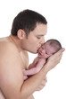 Father kissing newborn baby