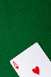 Ace on a green casino table with space for text