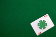 Ace with casino chip on a green casino table with space for text