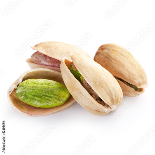 Photo: Pistachio nuts isolated on white background Pistachio nuts isolated on white background