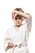 Child boy in kimono training karate
