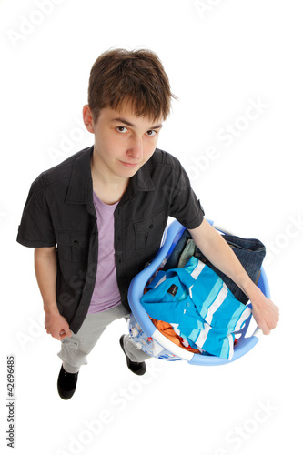 Photo: Teenager with basket of clothing Teenager with basket of clothing