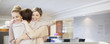 Businesswomen hugging in office