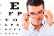 Photo: Man taking an eye exam Man taking an eye exam