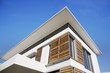Foto: Low angle view of wood shutters on modern house Low angle view of wood shutters on modern house