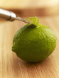 Close up of zester peeling lime