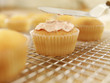 Icing being applied to cupcake