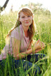 The red girl in a grass