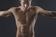 Portrait of muscular man with arms outstretched