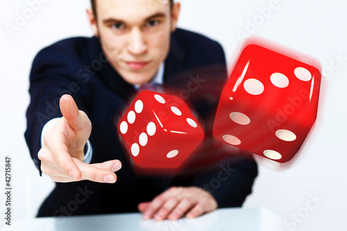 Photo: Flying dices as symbol of risk Flying dices as symbol of risk