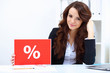 Foto: Young business woman with sale sign Young business woman with sale sign