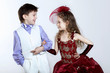 Foto: Little girl in beautiful dress and boy Little girl in beautiful dress and boy