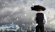 Photo: Business person under money rain Business person under money rain