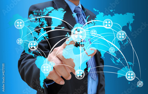 Photo: businessman hand pushing social network on world map businessman hand pushing social network on world map