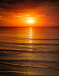 Sunrise in the sea with softwave and cloudy