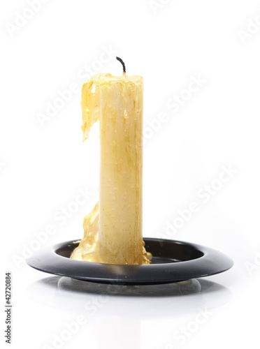 Photo: Burned candle isolated Burned candle isolated