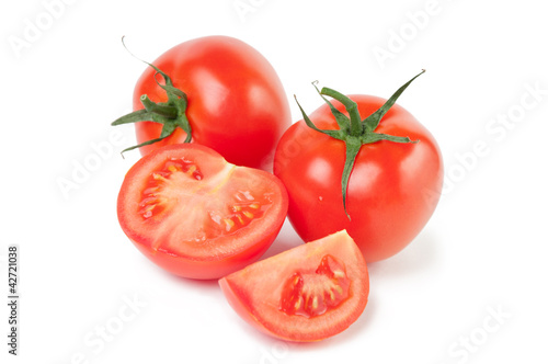 Photo: Studio shot of fresh and ripe tomatoes, white background Studio shot of fresh and ripe tomatoes, white background