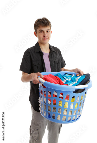 Photo: Teenager holding a basket of housework Teenager holding a basket of housework