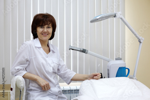 Photo: Smiling beauty salon woman worker. Smiling beauty salon woman worker.