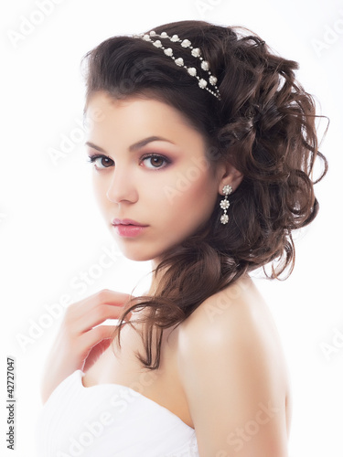 Photo: Portrait of beautiful young bride - isolated on white background Portrait of beautiful young bride - isolated on white background