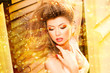 very beautiful model wearing gold make-up