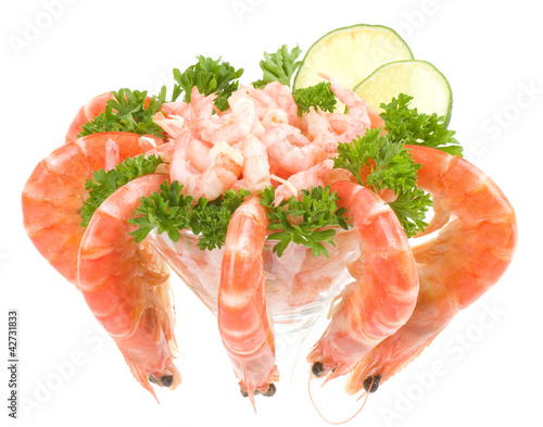 Photo: Chilled shrimp served with lime in a martini glass. Chilled shrimp served with lime in a martini glass.